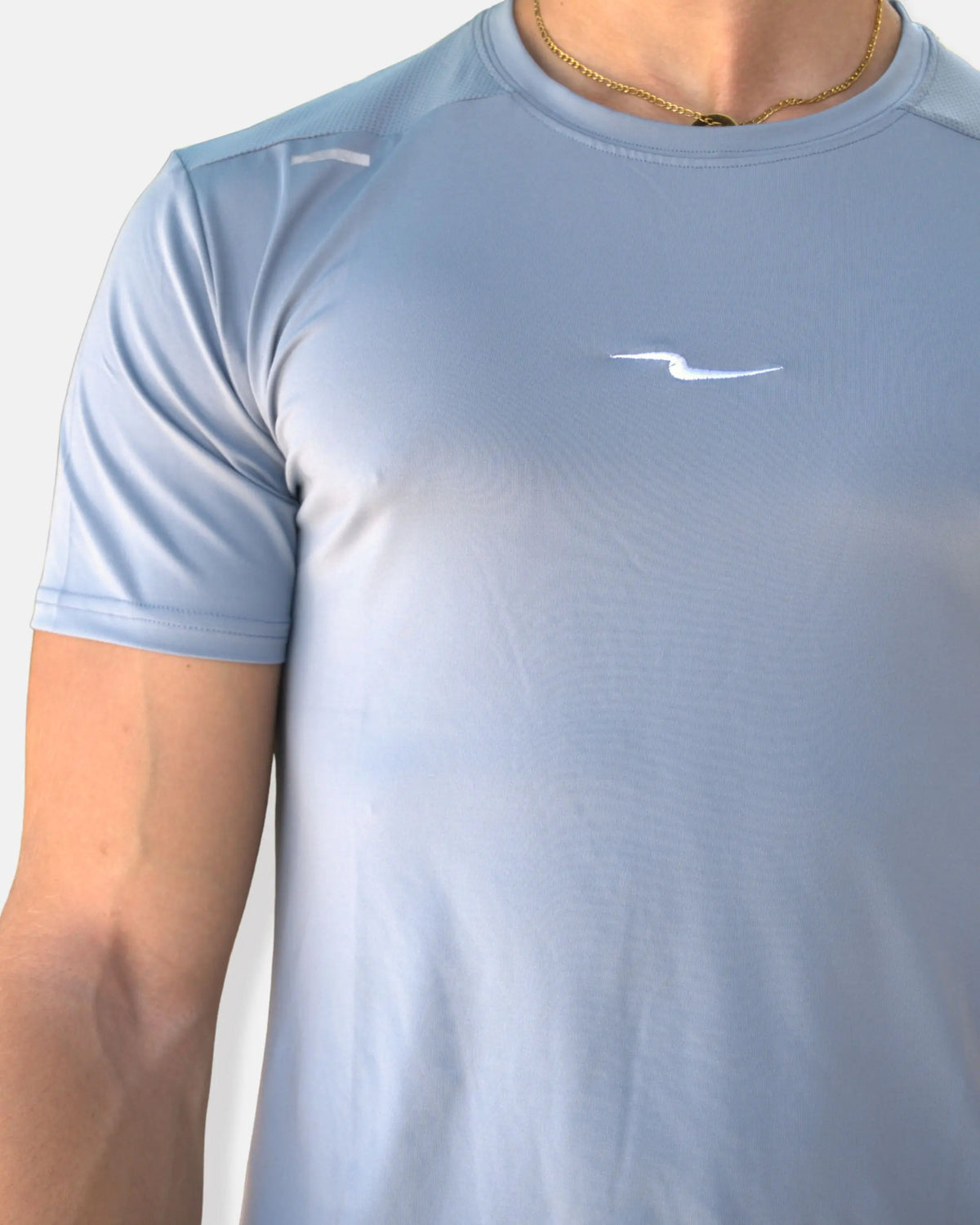 T-shirt running bleu ciel avec dos perforé et bande réfléchissante